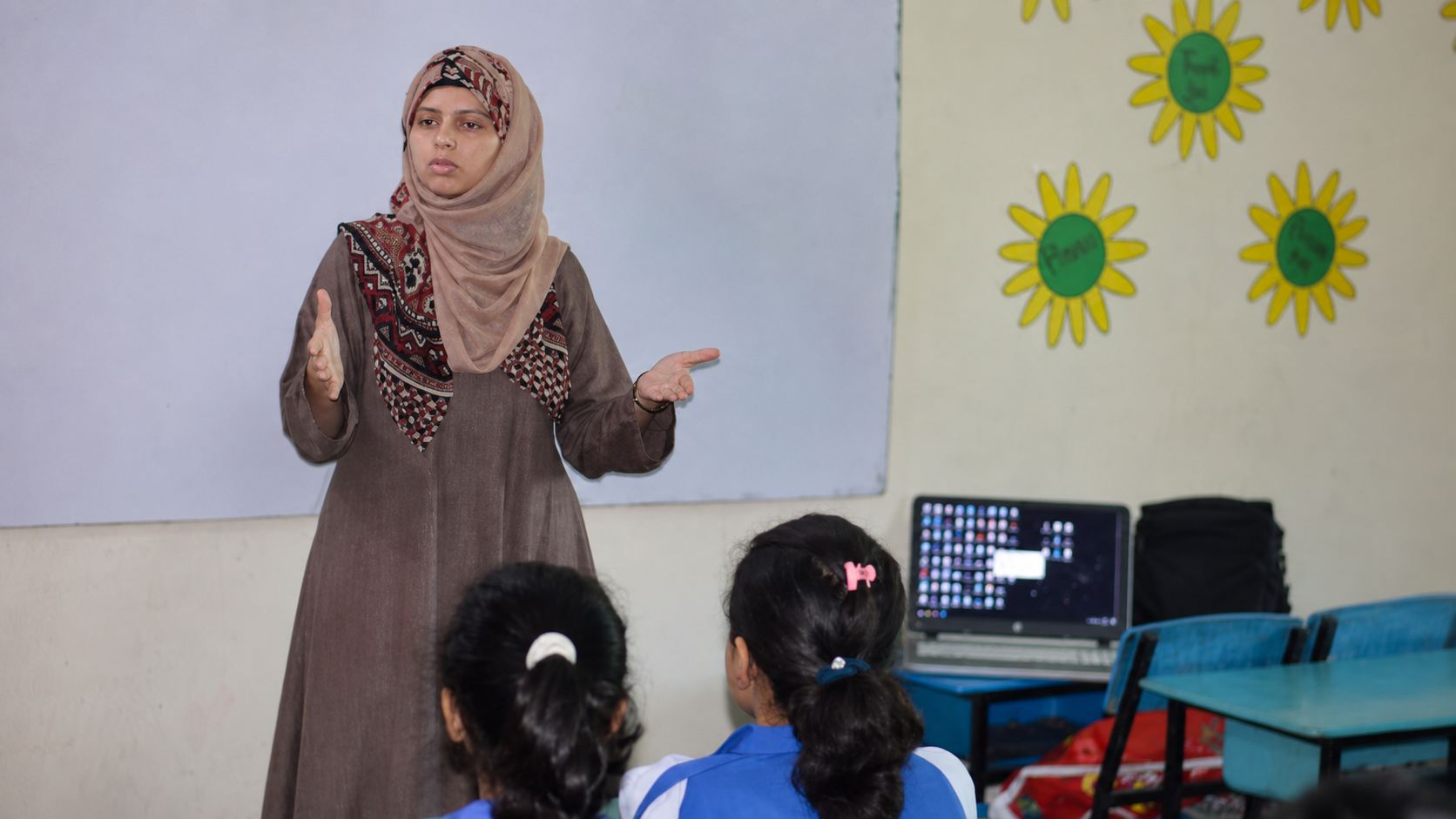 A teacher speaking to her class in a classroom in Rawalpindi.